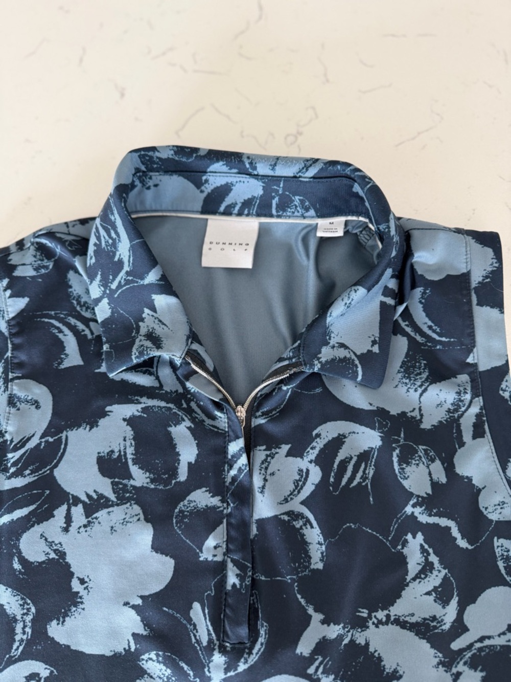Sleeveless polo in Navy and Light Blue Floral golf/tennis/pickleball - Picture 3 of 3